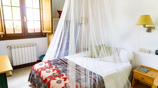 queen size bed with mosquito net